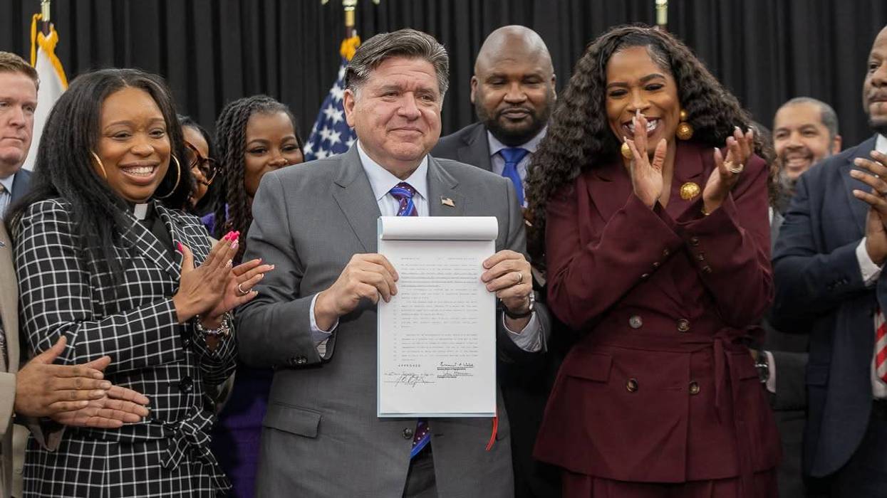 Pritzker and organizers pose with Clean Slate Act.