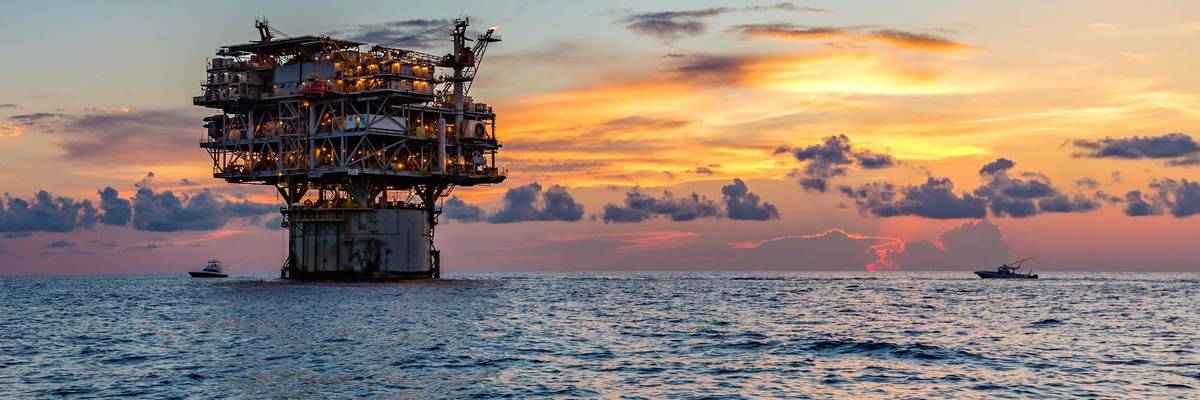 Private fishing boats near offshore petroleum drilling rig in the Gulf of Mexico