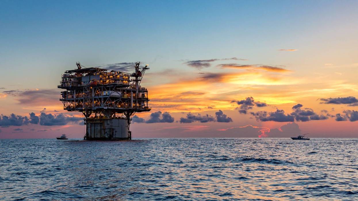 Private fishing boats near offshore petroleum drilling rig in the Gulf of Mexico