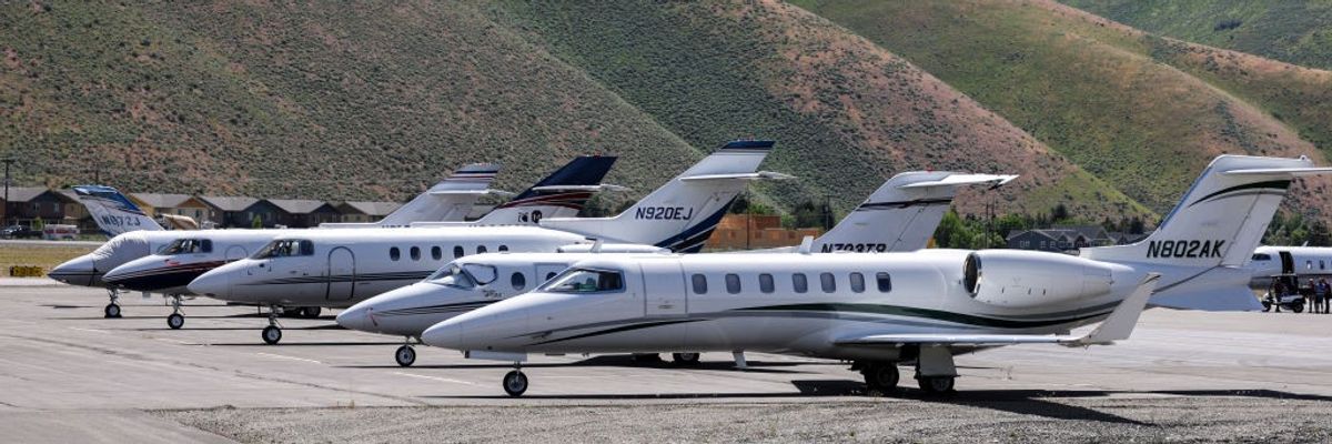 Private jets are seen on a tarmac