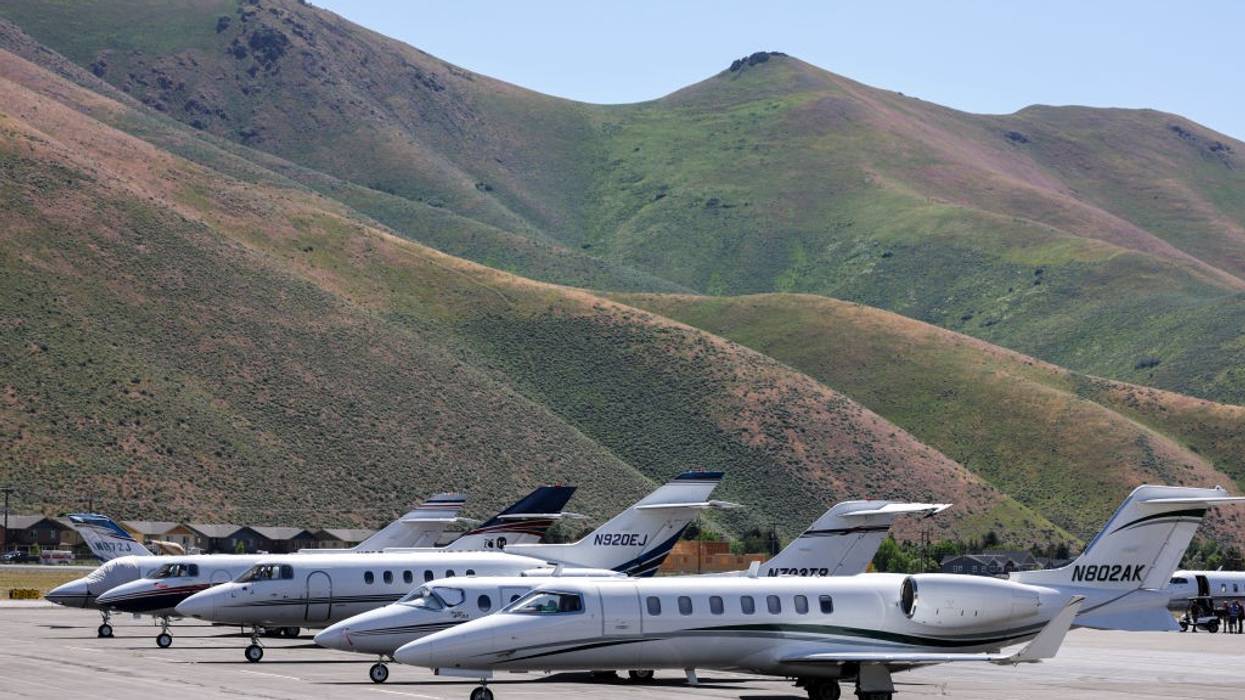 Private jets are seen on a tarmac