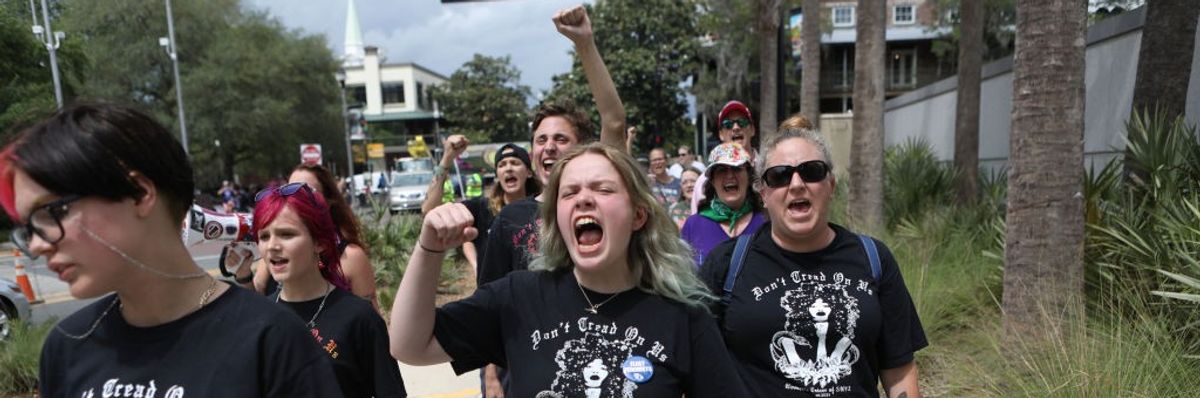 Pro-choice protesters walk near the Florida State Capitol