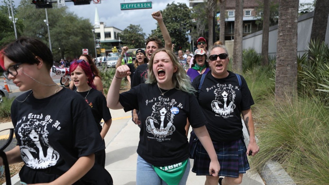 Pro-choice protesters walk near the Florida State Capitol
