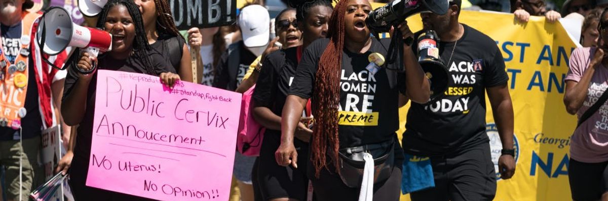 Pro-choice protestors march and chant in Atlanta