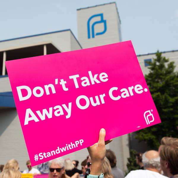 Pro-choice supporters and staff of Planned Parenthood hold a rally