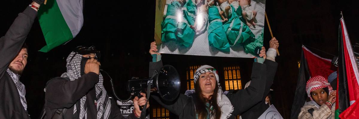 Pro-Palestinian protesters holding Palestinian flags