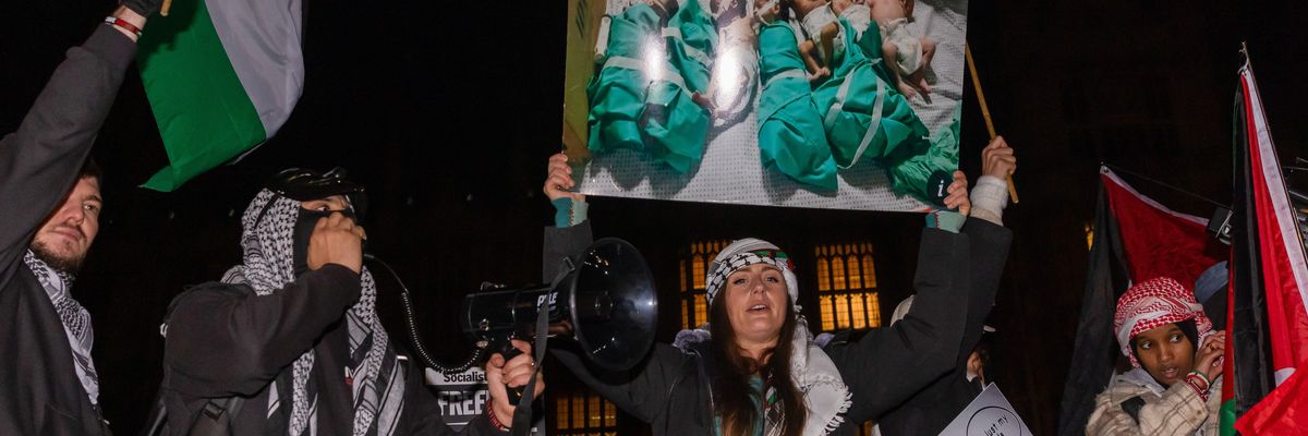 Pro-Palestinian protesters holding Palestinian flags