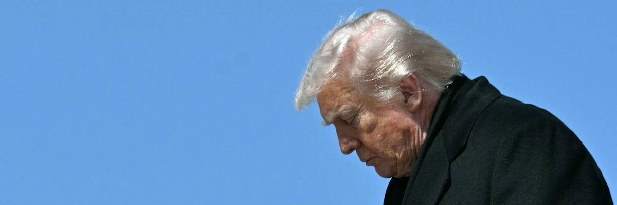 Profile of Trump exiting Air Force One.
