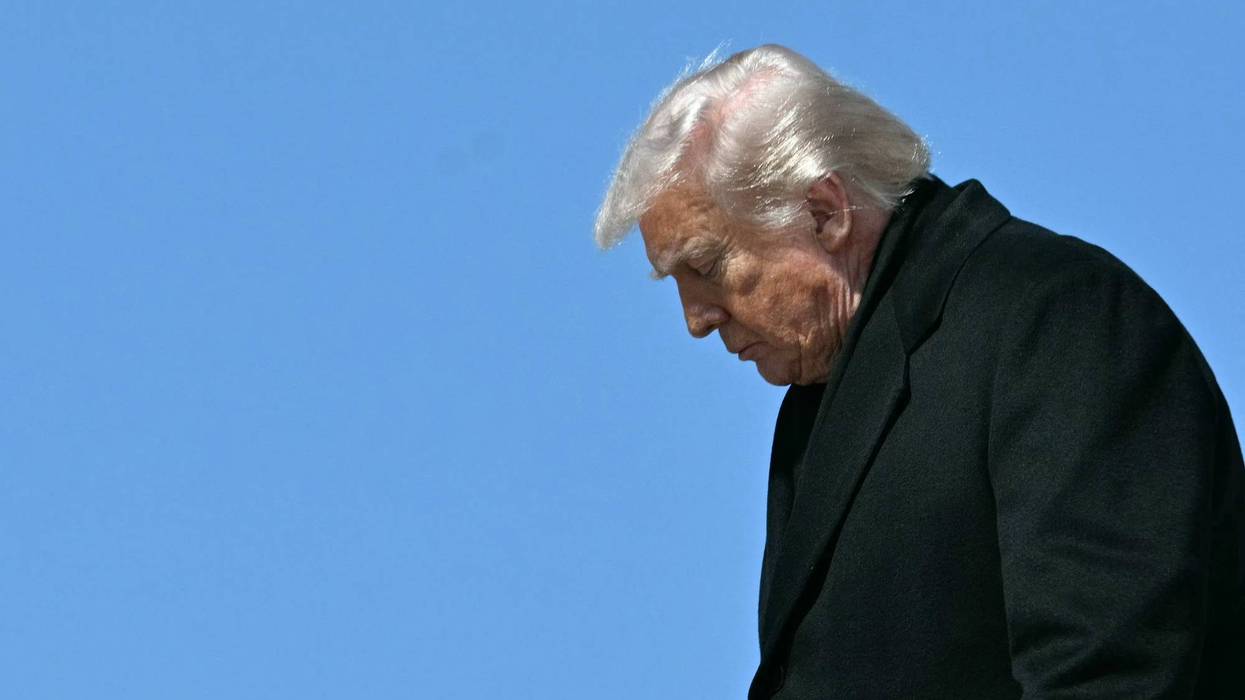 Profile of Trump exiting Air Force One.
