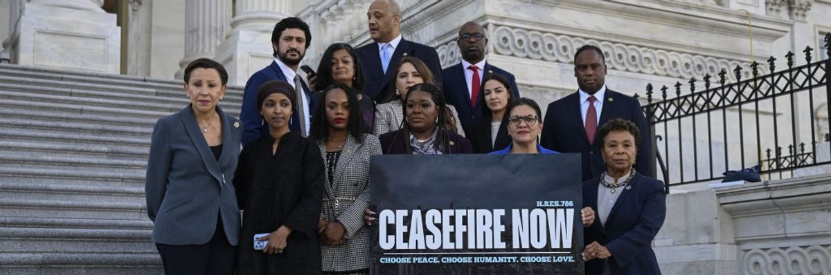 Progressive members of Congress hold a banner demanding a cease-fire