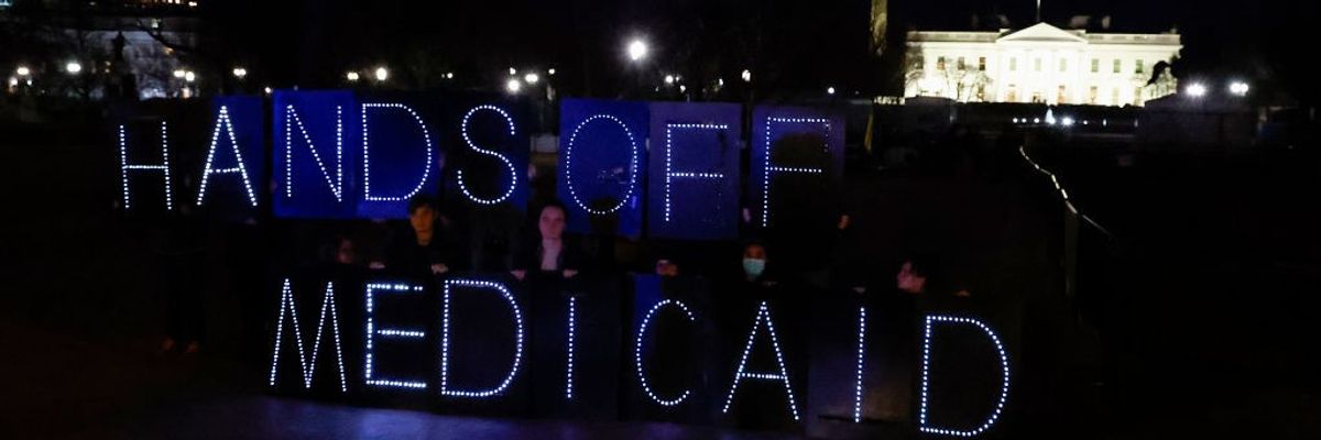 Protect Our Care Supporters Display "Hands Off Medicaid" Message In Front Of The White House Ahead Of President Trump's Address To Congress