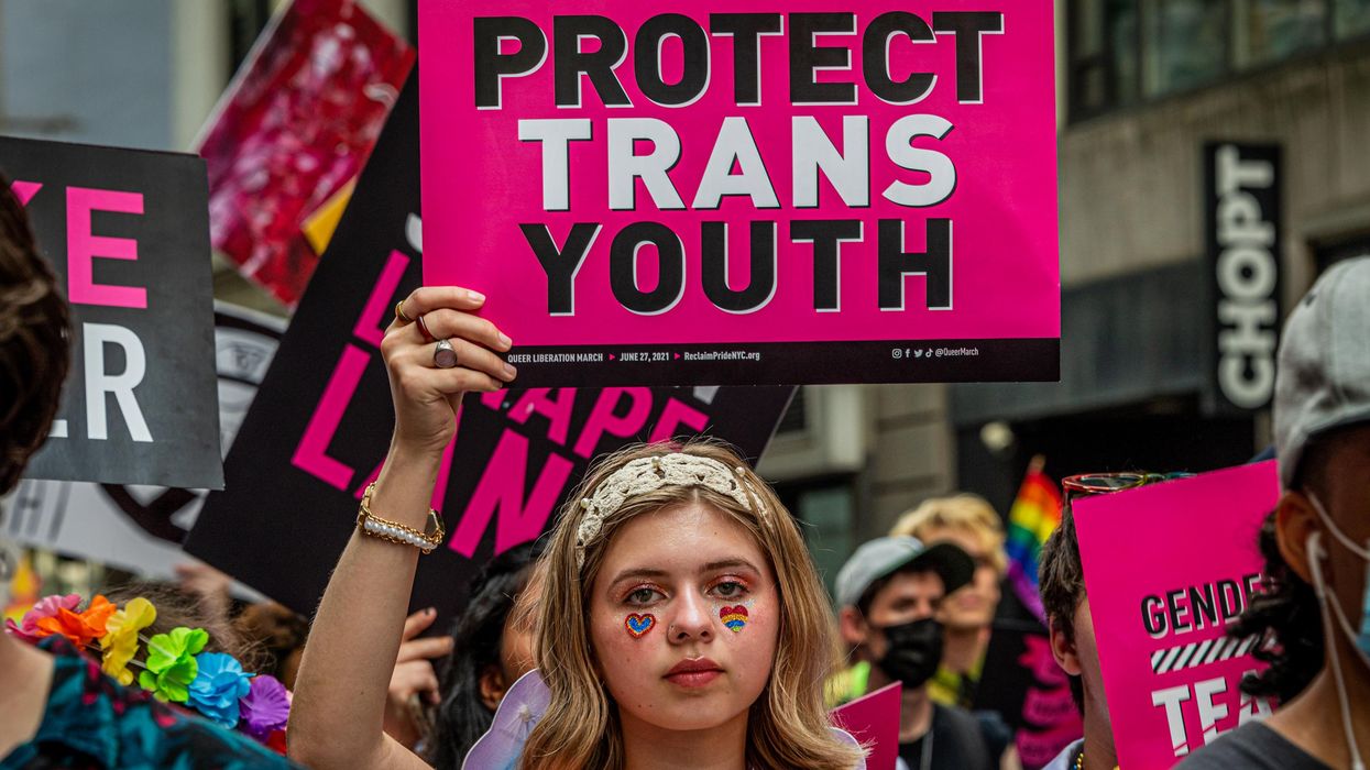 "Protect trans youth" sign
