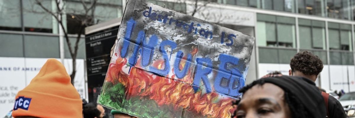 Protest against insurance companies causing environmental pollution in New York