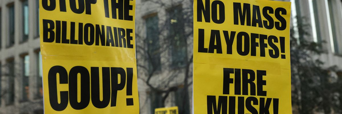 Protest signs against Musk's layoffs.