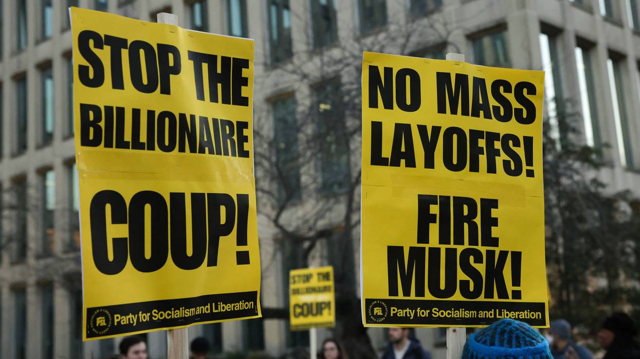 Protest signs against Musk's layoffs.