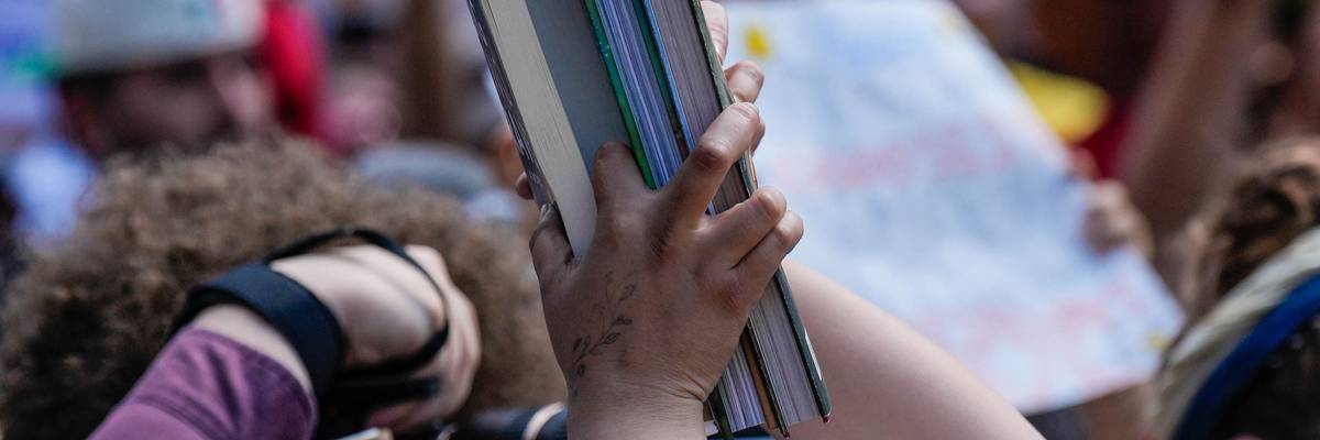 Protester holds books