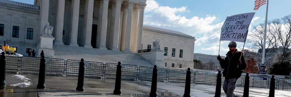 Protester outside Supreme Court