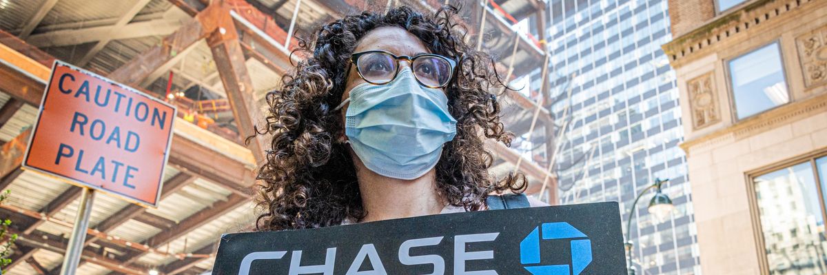 Protester seen holding a sign at the rally outside JP Morgan Headquarters on May 17, 2022.