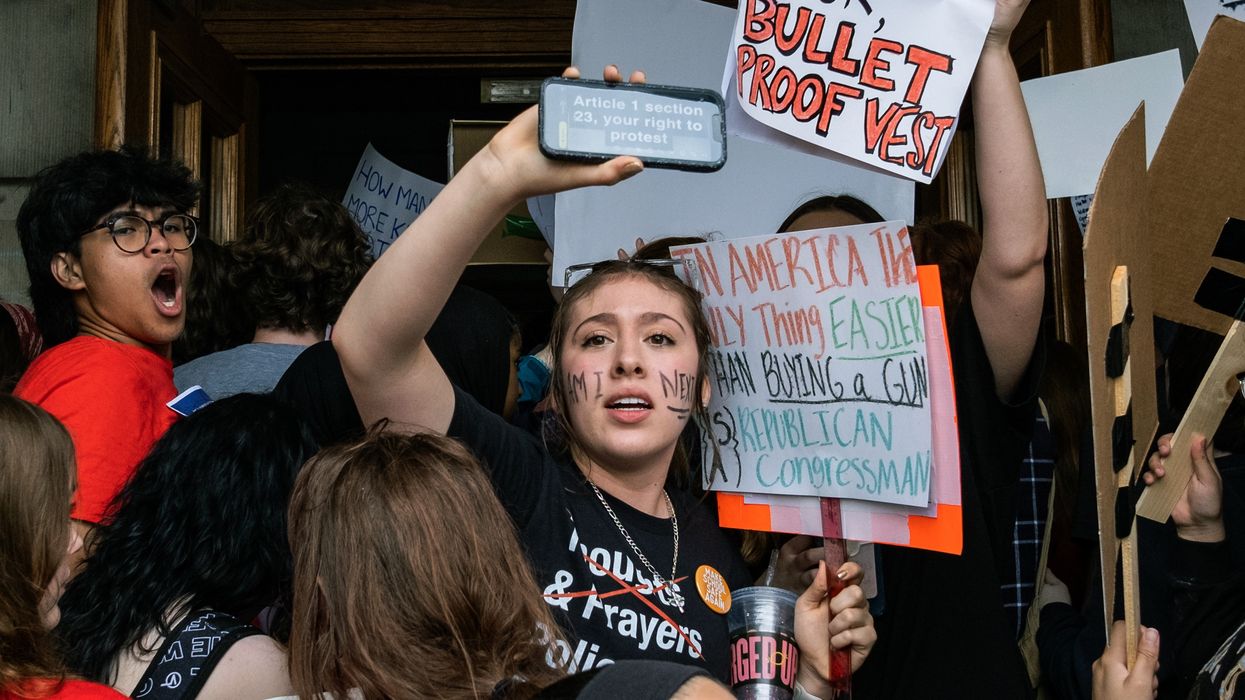 Protesters and students enter the Tennessee State Capitol building in protest