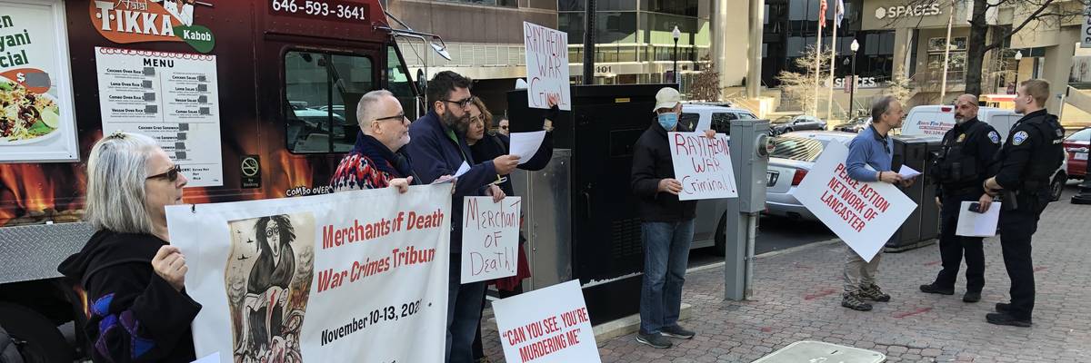 Protesters assemble outside military contractor Raytheon's headquarters in Arlington, Virginia on February 14, 2023