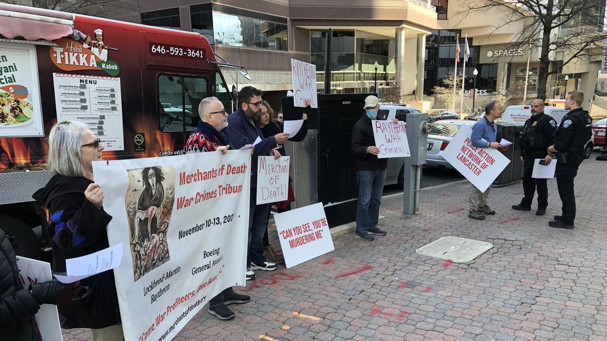 Protesters assemble outside military contractor Raytheon's headquarters in Arlington, Virginia on February 14, 2023