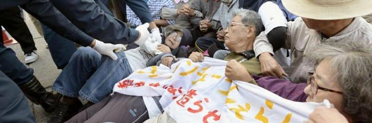 Vowing to Stop US Military Base, Okinawa Elders Dragged Away by Riot Police