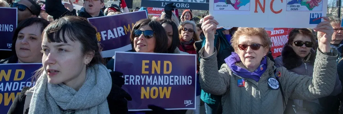 Protesters attend a rally for fair voting maps