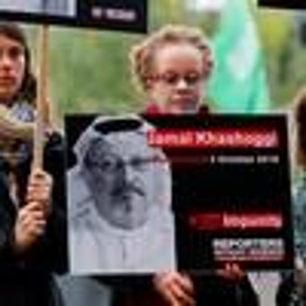 Protesters attend a vigil for Jamal Khashoggi