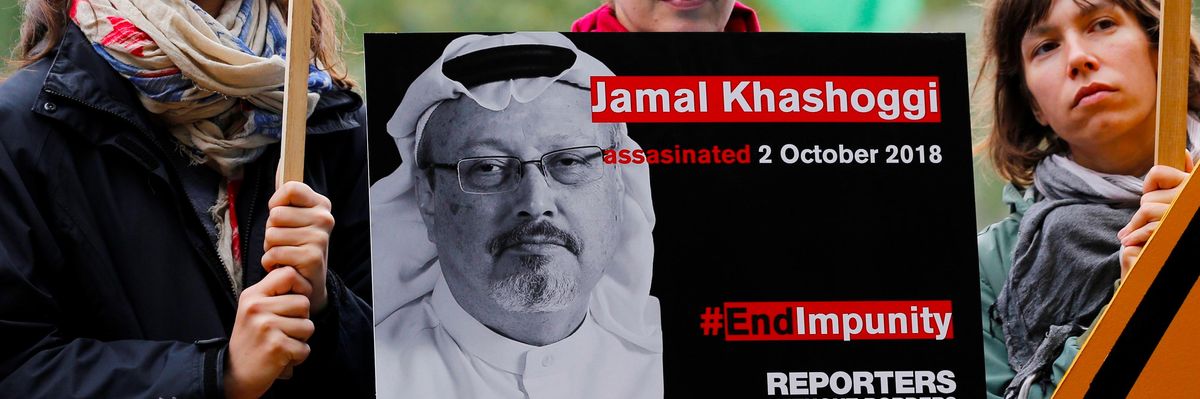 Protesters attend a vigil for Jamal Khashoggi