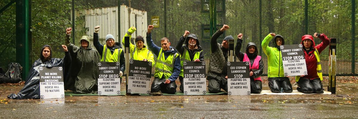 Protesters blockading UK oil site.