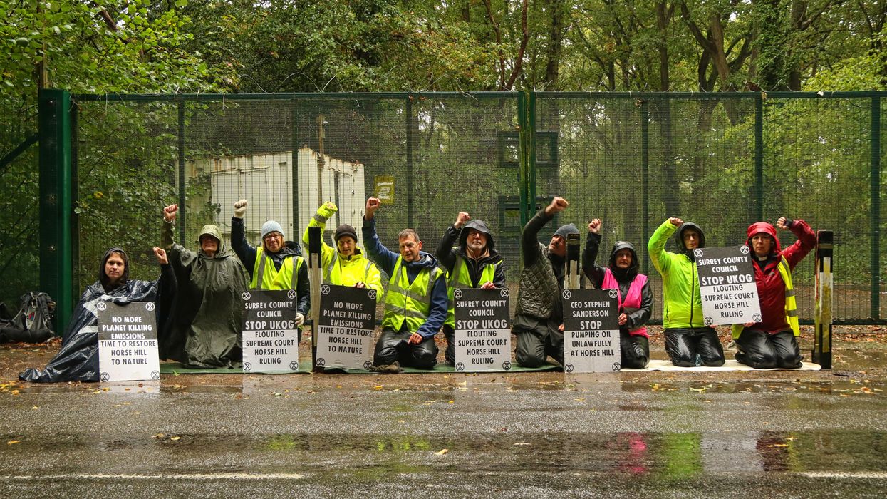 Protesters blockading UK oil site.