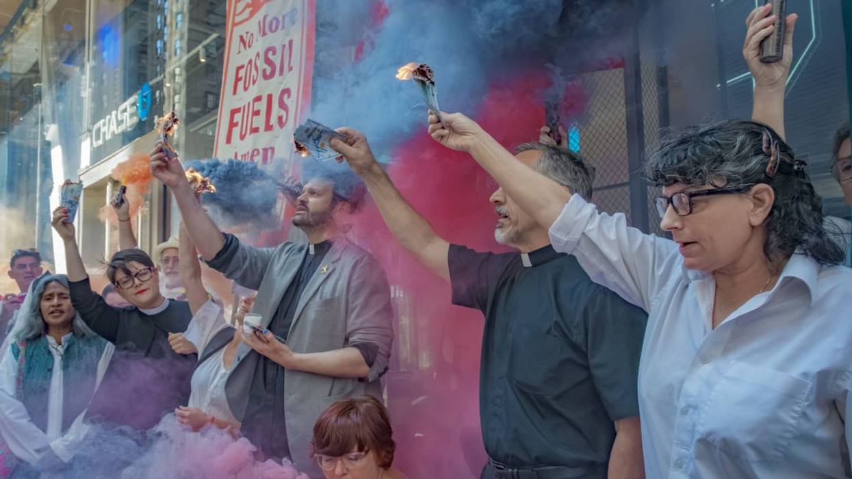 Protesters burning money.