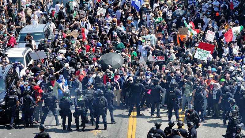 Protesters clash with police in Los Angeles as Trump administration continues immigration raids