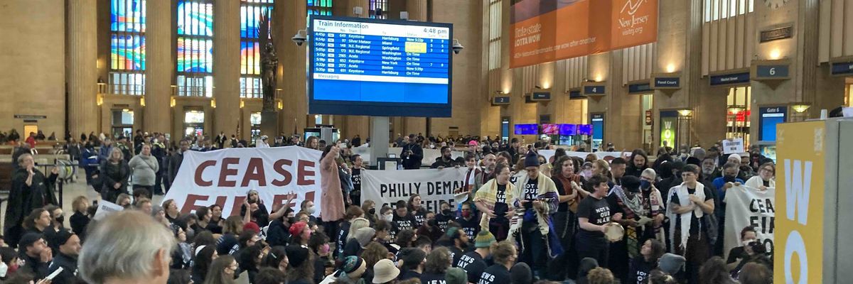 Protesters demand a cease-fire in Philadelphia's 30th Street Station.