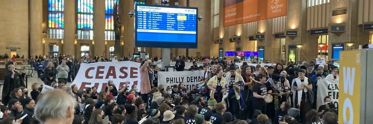 Protesters demand a cease-fire in Philadelphia's 30th Street Station.