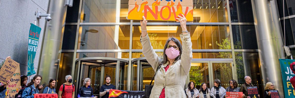 Protesters demand climate action in New York City on October 18, 2021.