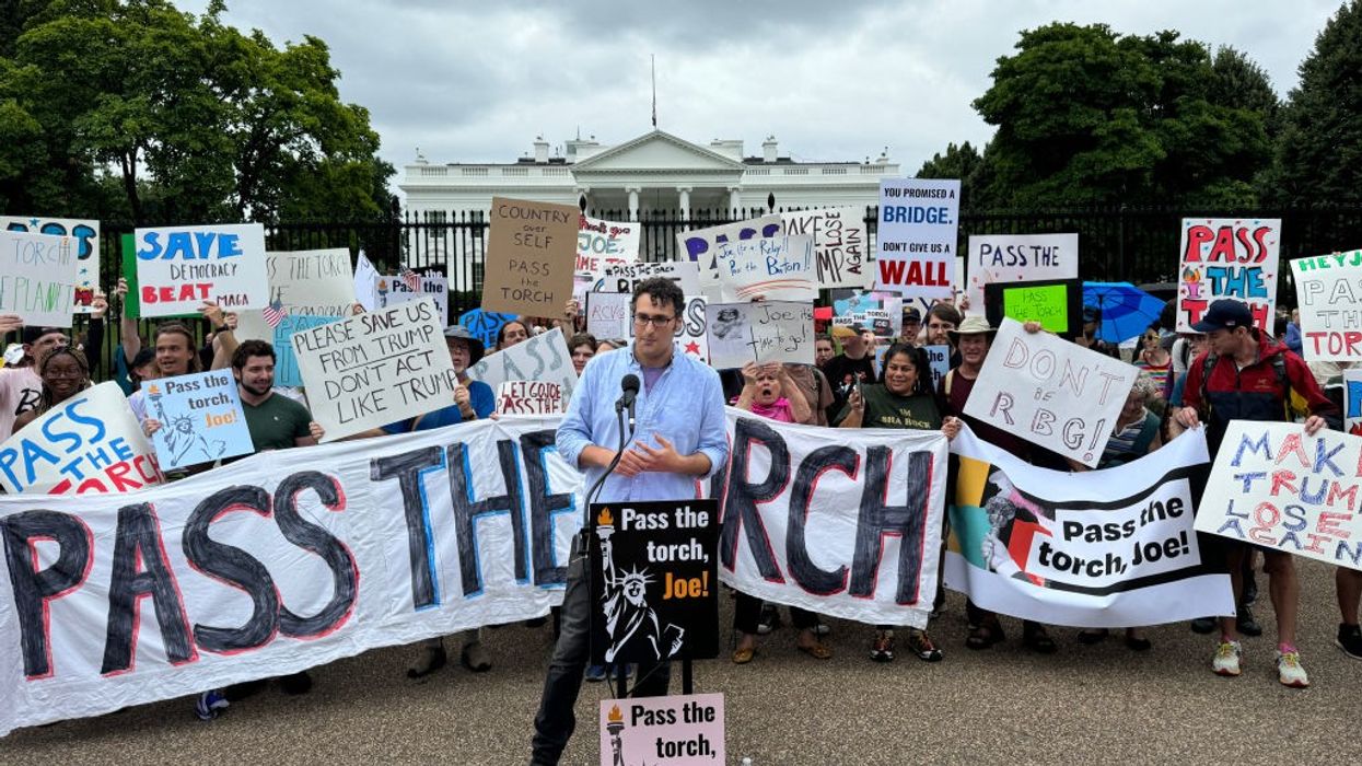 Protesters demand US President Joe Biden "Pass the Torch"