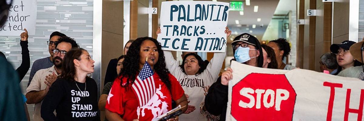 Protesters demonstrate against Palantir contracts with ICE