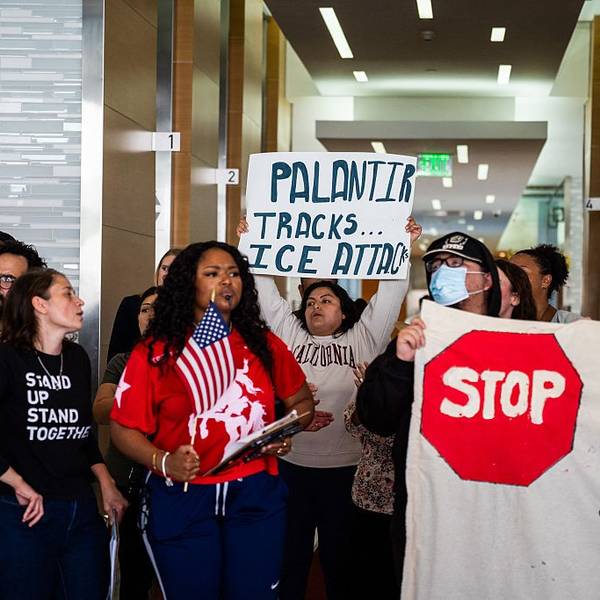 Protesters demonstrate against Palantir contracts with ICE