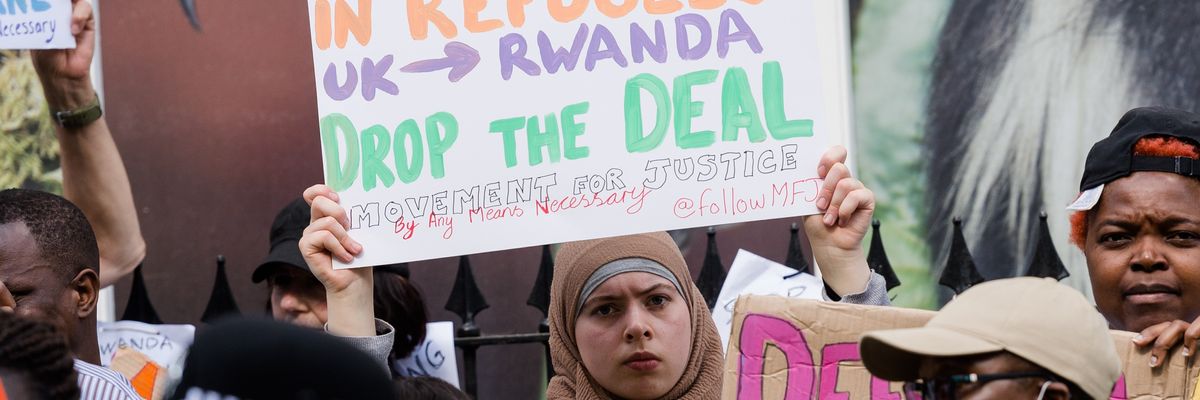 ​Protesters demonstrate against the U.K. government's plan to deport asylum-seekers to Rwanda on June 8, 2022 in London.