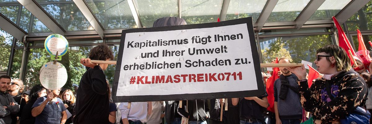 Protesters demonstrate outside a Deutsche Bank branch in Germany