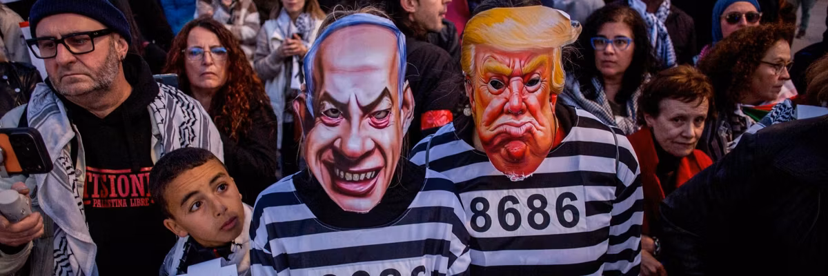Protesters dressed as prisoners wearing masks of Benjamin