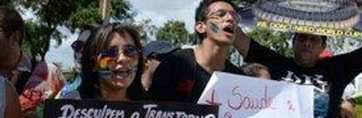 'Brazil, Wake Up!': Protesters Face Down Troops Outside of Stadium