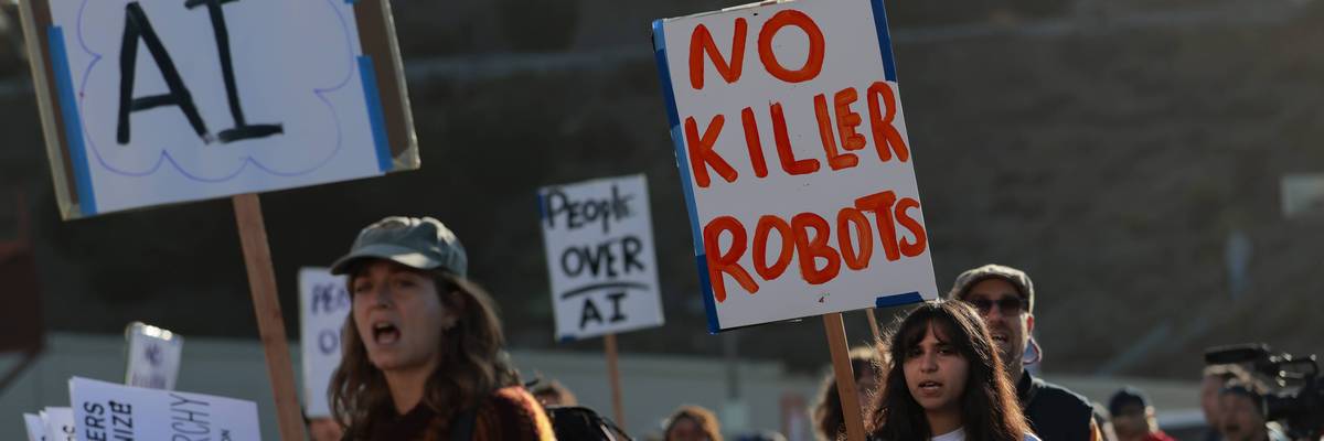 Protesters gather outside an OpenAI developers conference