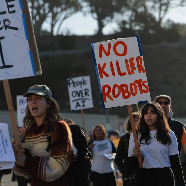 Protesters gather outside an OpenAI developers conference