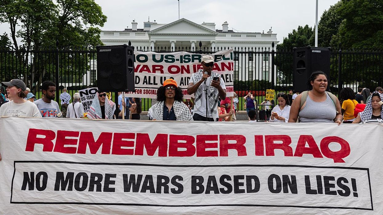 Protesters gather outside the White House to condemn US...