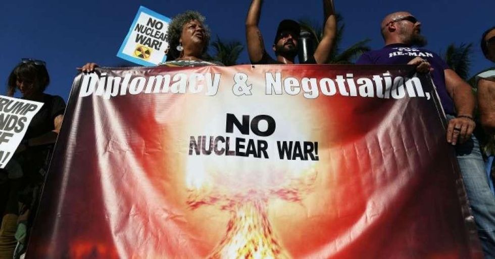 Protesters gathered to ask President Donald Trump to stop his drive to war against North Korea on August 14, 2017 in Miami, Florida. (Photo: Joe Raedle/Getty Images)