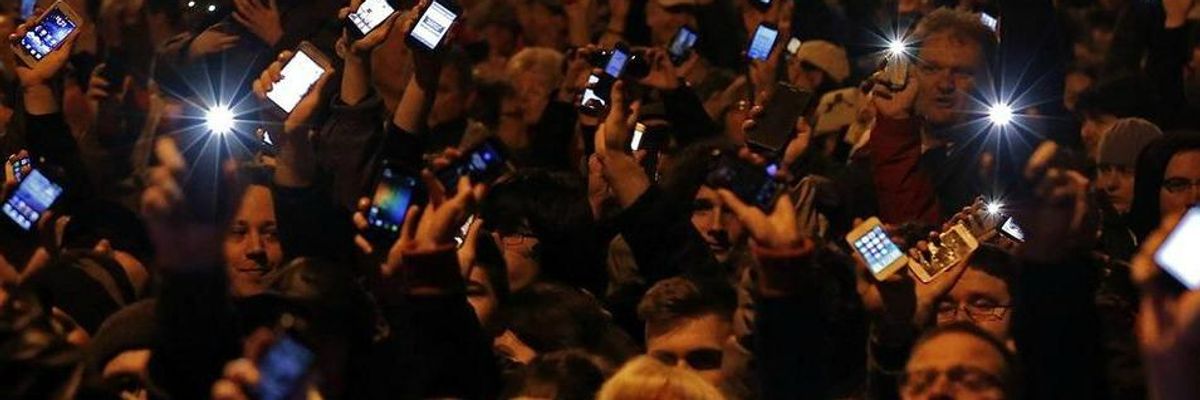 Holding Computers Aloft, Thousands March in Budapest Against Anti-Democratic Internet Tax