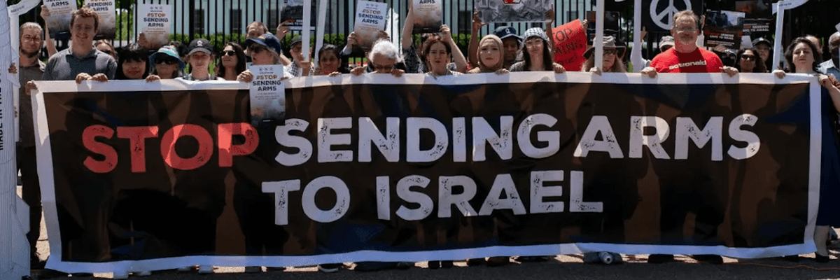 Protesters hold a banner reading "Stop Sending Arms to Israel" outside the White House.