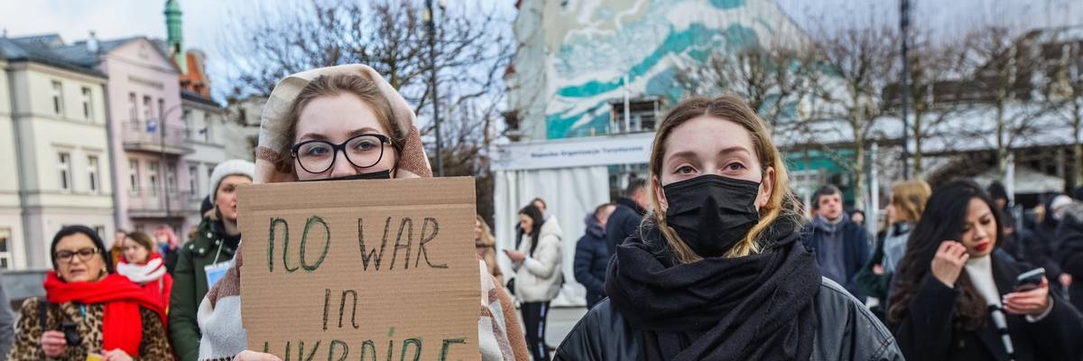 Protesters hold anti-war signs and Ukrainian flags in Sopot, Poland on February 26, 2022.